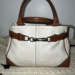 Coach cream and brown leather bag with top handle.
